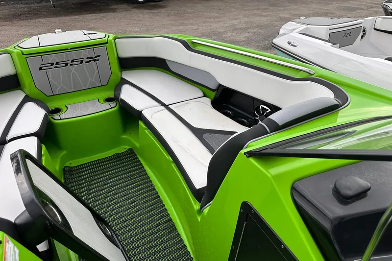 Slide: The Image of 2022 Yamaha Boats 255XD interior with green and white seating, showcasing modern design. - 12