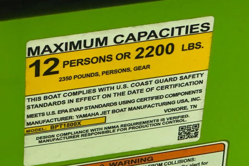 Slide: The Image of Yamaha Boats 2022 255XD capacity label: 12 persons or 2200 lbs, safety compliance. - 13