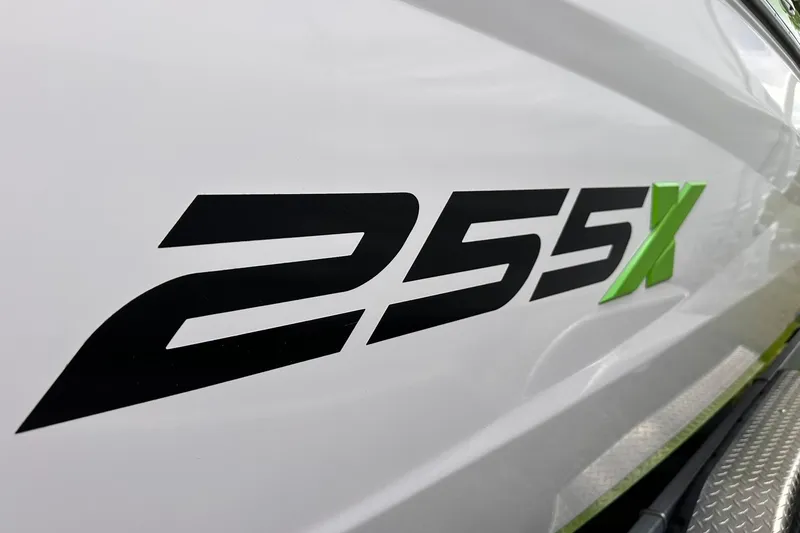 Slide: The Image of Close-up of 2022 Yamaha Boats 255XD model logo on white surface. - 2