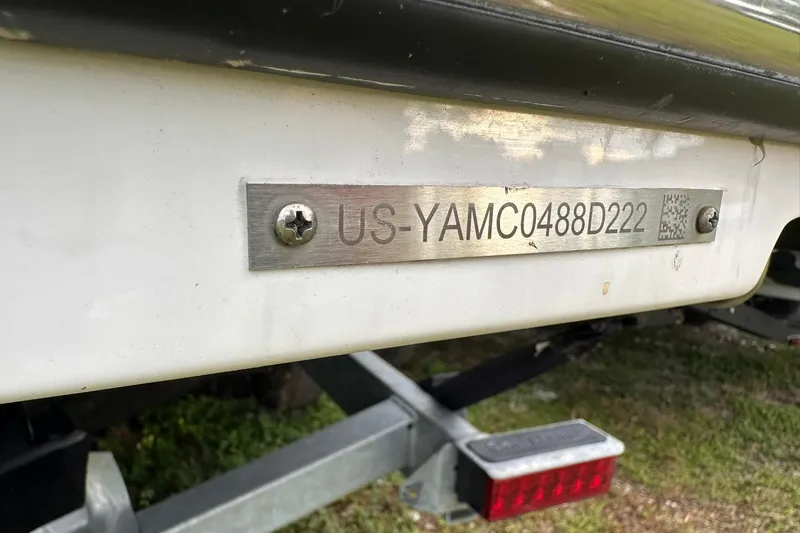 Slide: The Image of 2022 Yamaha Boats 255XD hull identification number plate on trailer. - 21