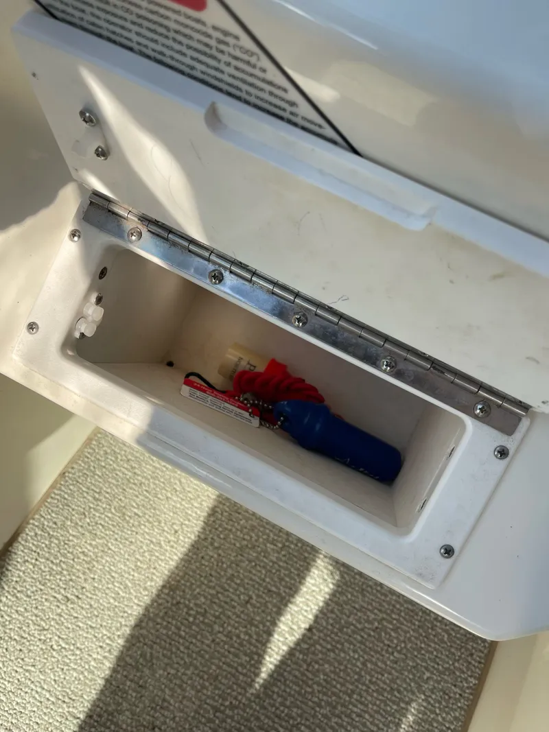 Slide: The Image of Storage compartment in 1998 Sea Ray 280 Bow Rider boat. - 6