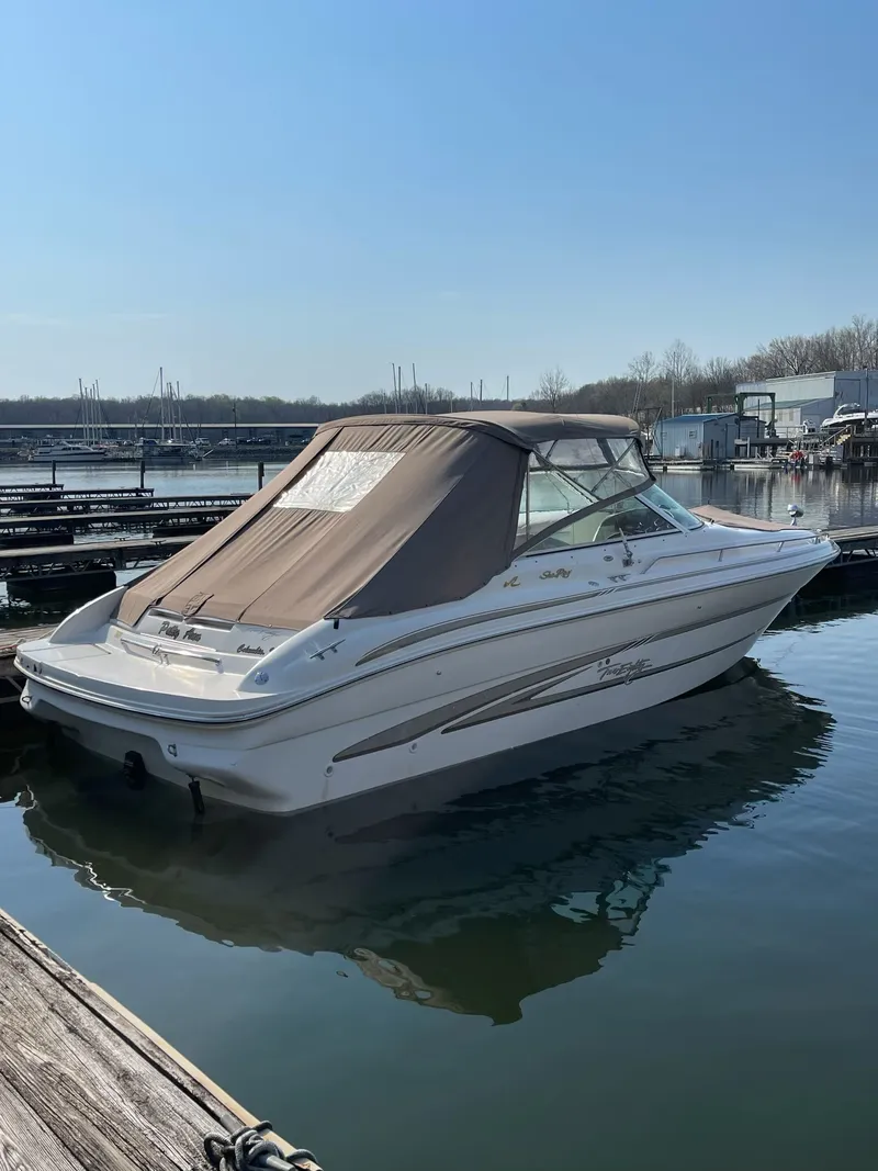 Slide: The Image of 1998 Sea Ray 280 Bow Rider boat docked in harbor. - 9