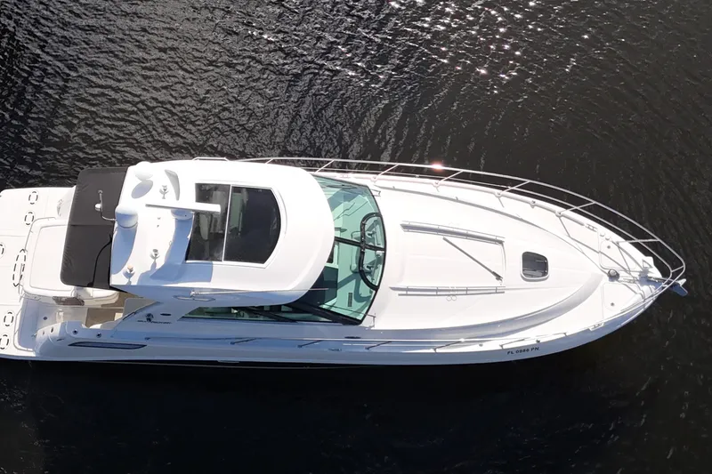 Slide: The Image of 2011 Sea Ray 450 Sundancer yacht cruising on water, aerial view. - 13