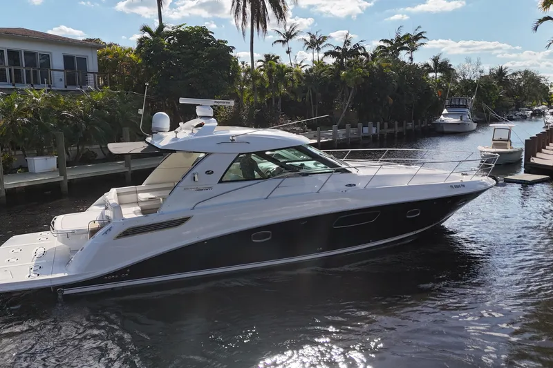 Slide: The Image of Interior view of 2011 Sea Ray 450 Sundancer yacht cockpit with modern controls. - 19