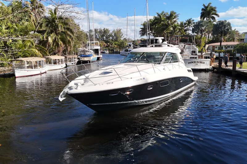 Slide: The Image of Luxurious interior of 2011 Sea Ray 450 Sundancer yacht, docked by the water. - 21