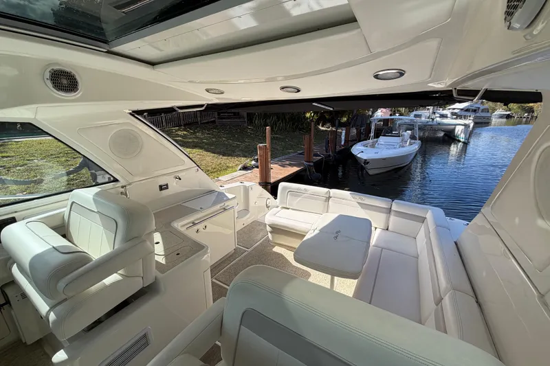 Slide: The Image of 2011 Sea Ray 450 Sundancer yacht cruising on a scenic, tropical waterway. - 29