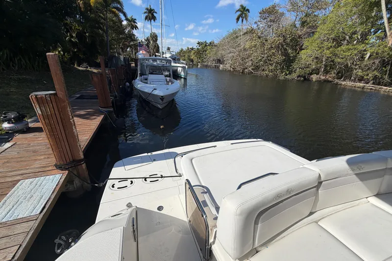 Slide: The Image of Interior of 2011 Sea Ray 450 Sundancer yacht with wooden flooring and modern design. - 32