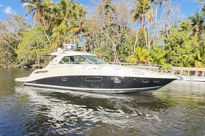 Slide: The Image of Interior of 2011 Sea Ray 450 Sundancer yacht with seating and control panel. - 37
