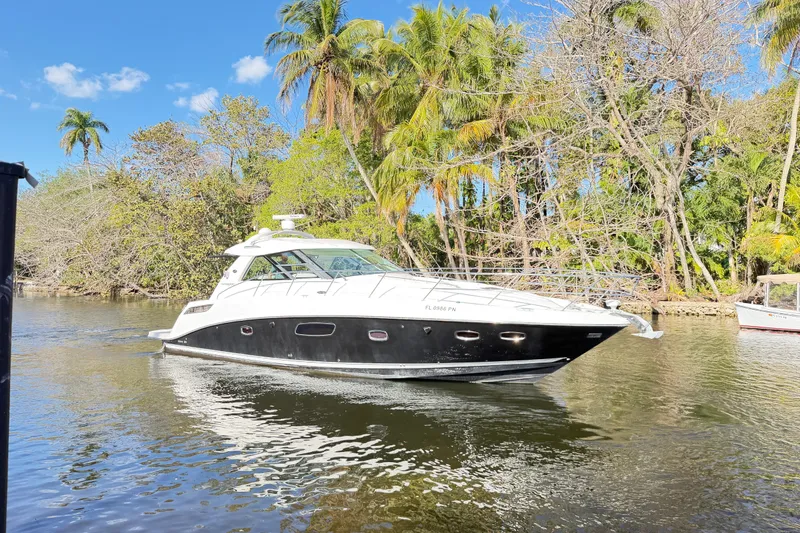 Slide: The Image of Luxurious 2011 Sea Ray 450 Sundancer yacht kitchen with sleek wood cabinetry and modern appliances. - 38