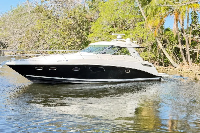 Slide: The Image of Luxurious cabin interior of 2011 Sea Ray 450 Sundancer yacht with cozy bedding. - 40