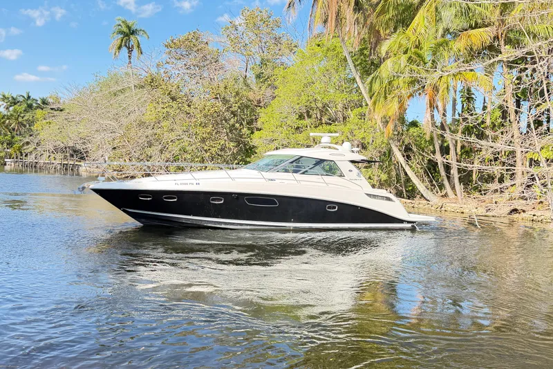 Slide: The Image of 2011 Sea Ray 450 Sundancer yacht bathroom with shower and porthole window. - 43