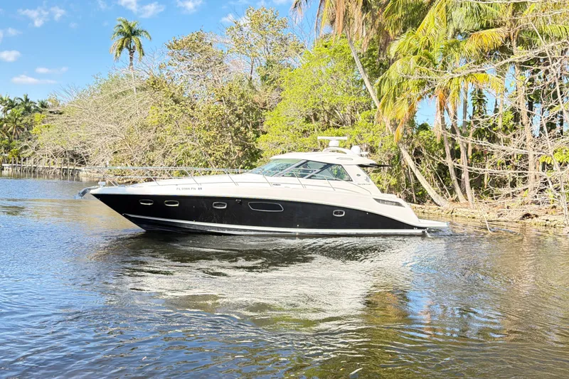 Slide: The Image of Luxurious interior of 2011 Sea Ray 450 Sundancer yacht with modern kitchen and seating area. - 44