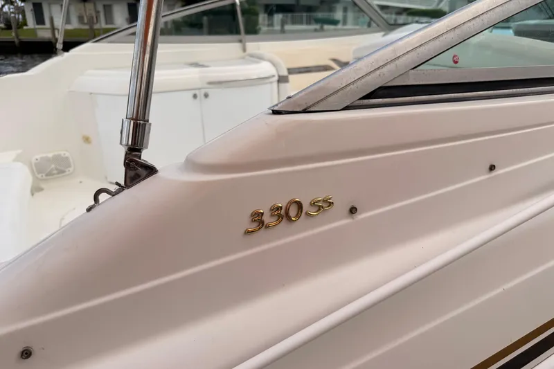 Slide: The Image of 2002 Formula 330 Sun Sport boat, close-up of the "330 SS" emblem. - 13