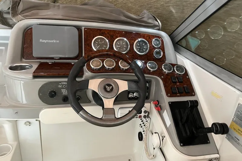 Slide: The Image of Dashboard of a 2002 Formula 330 Sun Sport boat with steering wheel and gauges. - 23