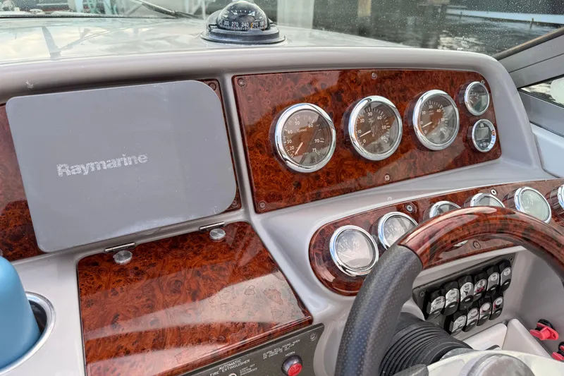 Slide: The Image of Dashboard of a 2002 Formula 330 Sun Sport boat with Raymarine equipment. - 25
