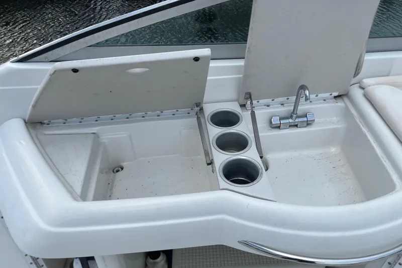 Slide: The Image of 2002 Formula 330 Sun Sport boat sink and cup holders on deck. - 27