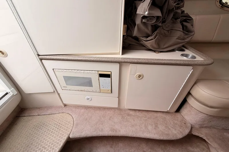 Slide: The Image of 2002 Formula 330 Sun Sport interior with microwave and storage cabinets. - 45