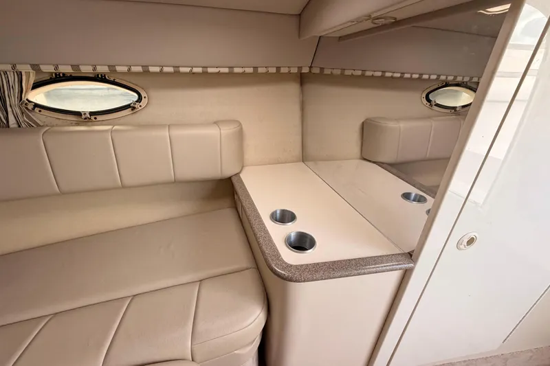 Slide: The Image of 2002 Formula 330 Sun Sport cabin interior with seating and portholes. - 47