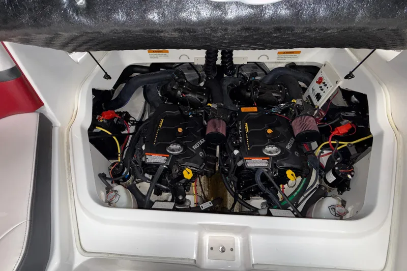 Slide: The Image of Engine compartment of 2019 Chaparral Vortex 2430 VRX boat, showcasing dual Rotax engines. - 11