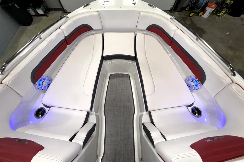 Slide: The Image of 2019 Chaparral Vortex 2430 VRX boat interior with white and red seating, blue LED lights. - 12
