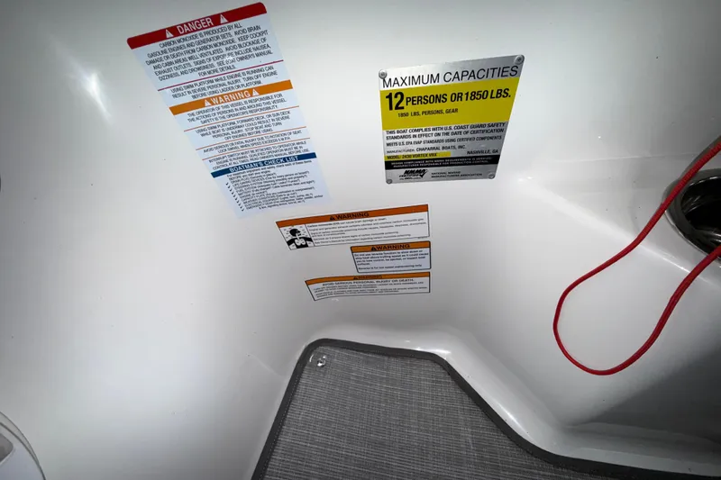 Slide: The Image of 2019 Chaparral Vortex 2430 VRX safety labels, maximum capacity 12 persons or 1850 lbs. - 20