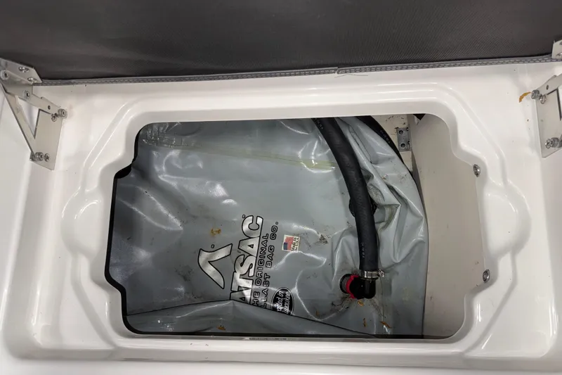 Slide: The Image of 2019 Chaparral Vortex 2430 VRX ballast bag compartment with hose connection. - 22