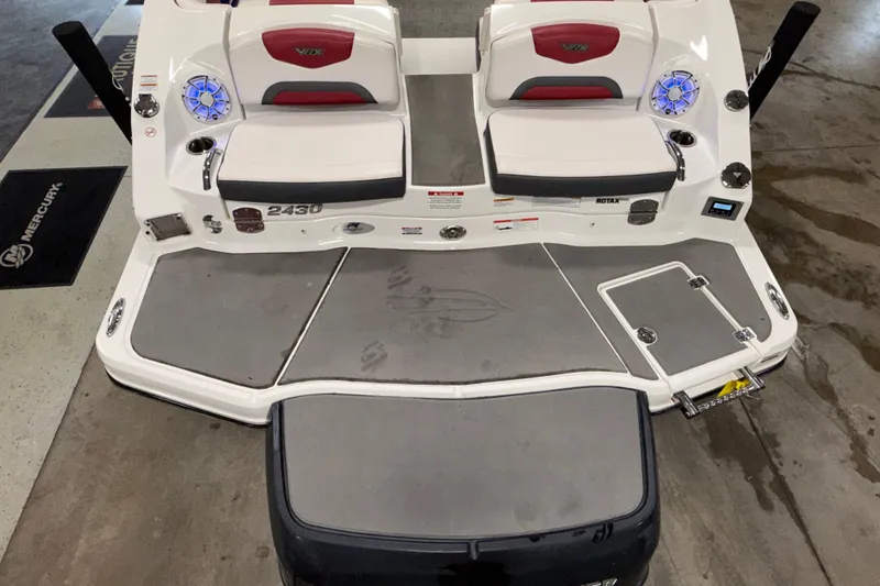 Slide: The Image of 2019 Chaparral Vortex 2430 VRX boat interior with seating and deck features. - 27