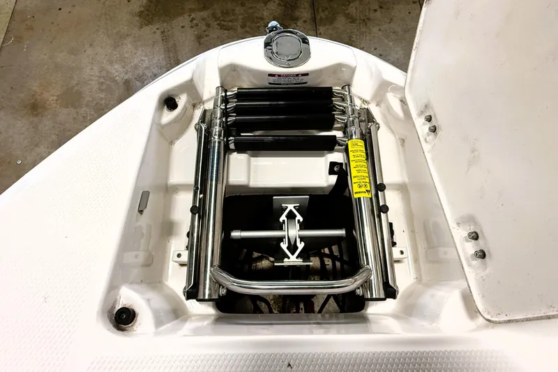 Slide: The Image of 2019 Chaparral Vortex 2430 VRX boat ladder compartment, featuring stainless steel retractable ladder. - 6