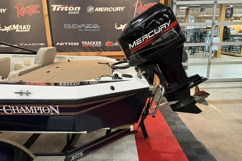 Slide: The Image of 1999 Champion 181 SX boat with Mercury XR6 150 outboard motor displayed indoors. - 3