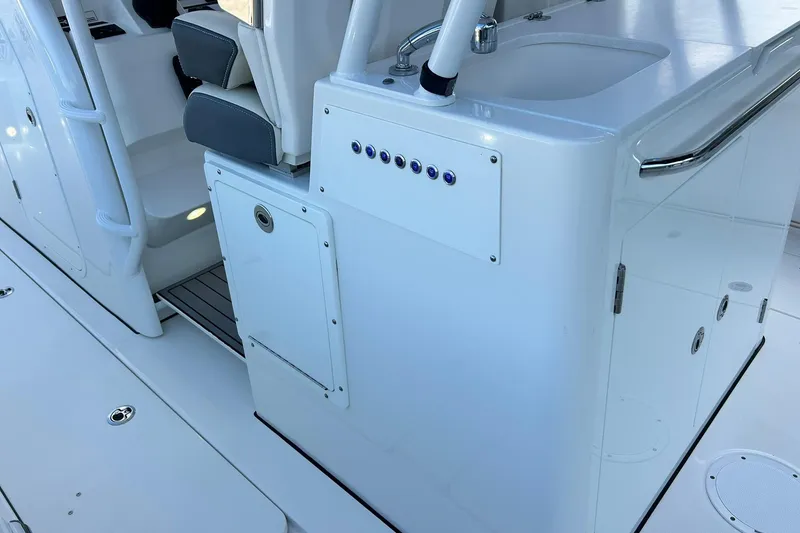 Slide: The Image of Edgewater 340CC 2021 boat interior with seating and sink area. - 17