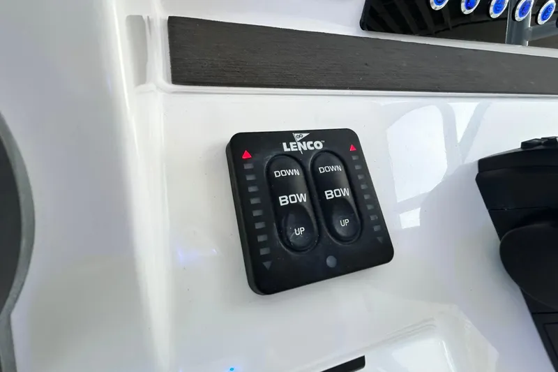Slide: The Image of Lenco trim tab control on 2021 Edgewater 340CC boat dashboard. - 24