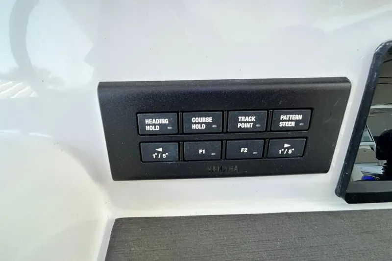 Slide: The Image of Control panel on 2021 Edgewater 340CC boat with navigation buttons. - 25