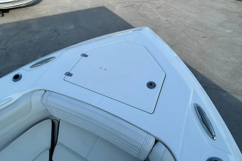 Slide: The Image of Bow seating area of 2021 Edgewater 340CC boat with storage compartment. - 39