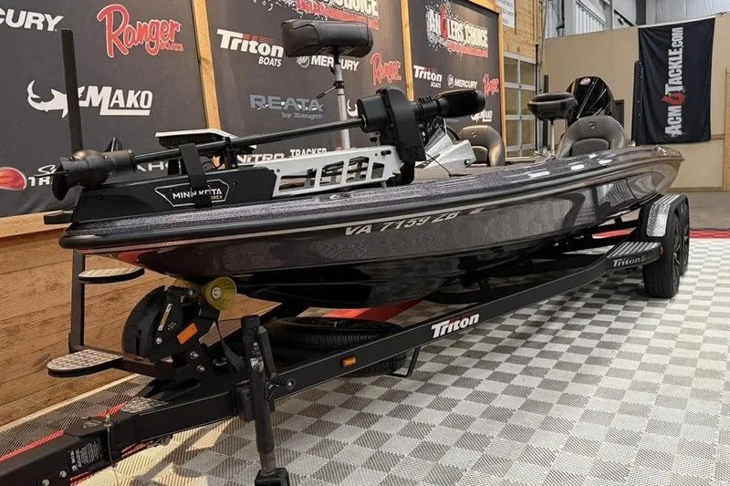 Slide: The Image of 2025 Triton 20XP Patriot boat on display in showroom with branded backdrop. - 4
