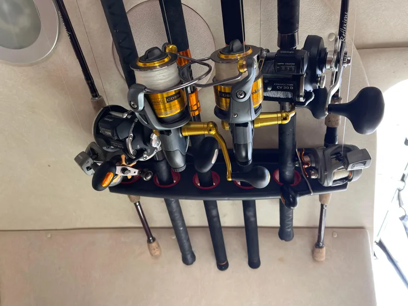 Slide: The Image of Fishing rods and reels stored on a 2005 Sea Ray Amberjack 290 boat. - 16