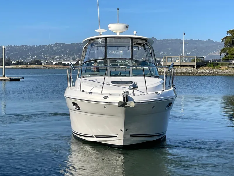 Slide: The Image of 2005 Sea Ray Amberjack 290 boat on calm water, front view. - 2