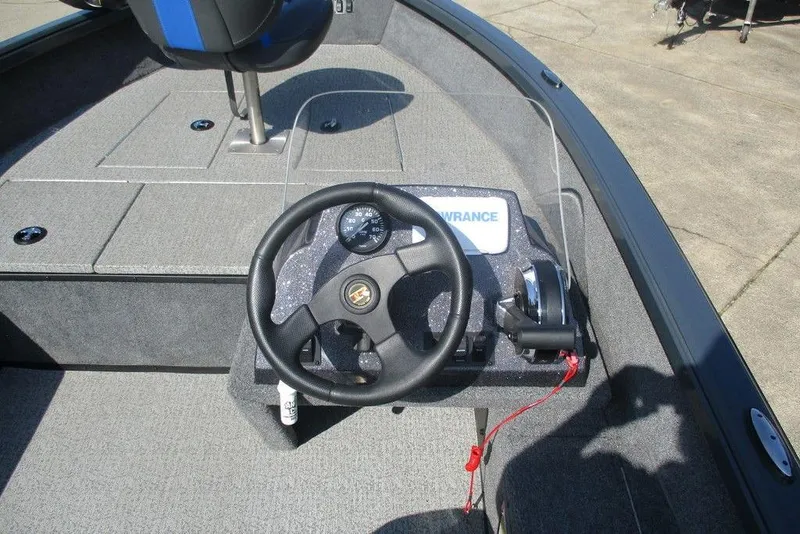 Slide: The Image of 2024 Ranger VS1665SC boat cockpit with steering wheel and control panel. - 3