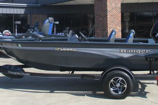 Slide: The Image of 2024 Ranger VS1665SC fishing boat parked outside a building. - 4