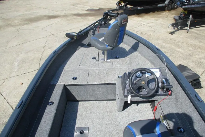 Slide: The Image of 2024 Ranger VS1665SC boat interior with steering wheel and seating. - 6