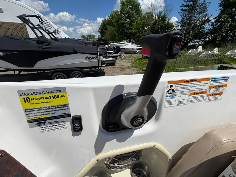 Slide: The Image of Hurricane 202 Sundeck Sport 2014 controls with capacity warning. - 13