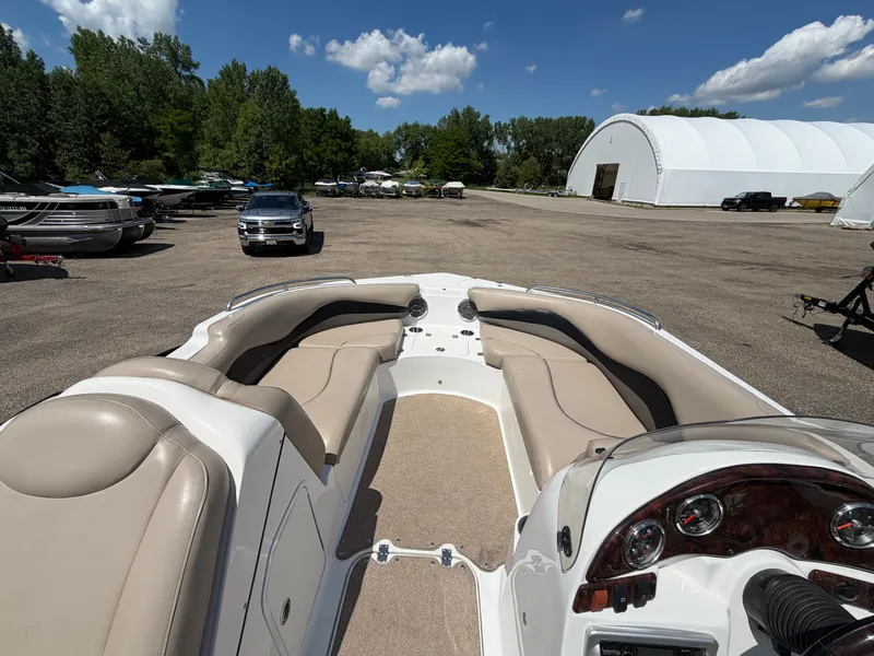 Slide: The Image of Interior view of a 2014 Hurricane 202 Sundeck Sport boat on a parking lot. - 16