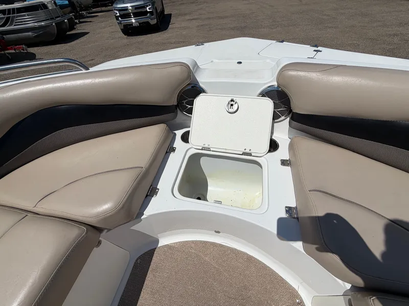 Slide: The Image of Interior of a 2014 Hurricane 202 Sundeck Sport boat with storage compartment. - 18