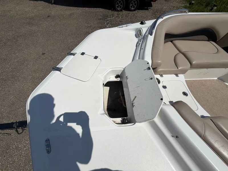 Slide: The Image of 2014 Hurricane 202 Sundeck Sport with open storage compartment and seating area. - 19
