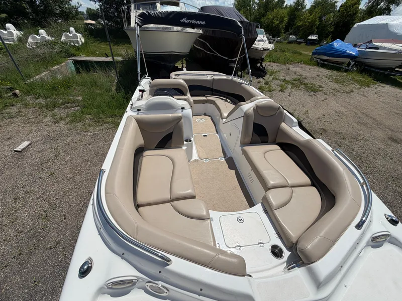 Slide: The Image of 2014 Hurricane 202 Sundeck Sport boat on a parking lot. - 21