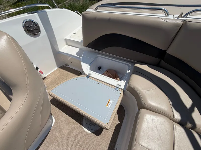 Slide: The Image of Interior of a 2014 Hurricane 202 Sundeck Sport boat with storage compartment. - 22