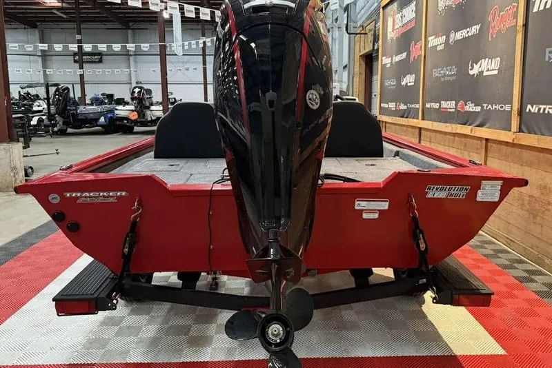 Slide: The Image of 2026 Tracker Pro Team 190 boat in showroom, rear view with motor. - 4