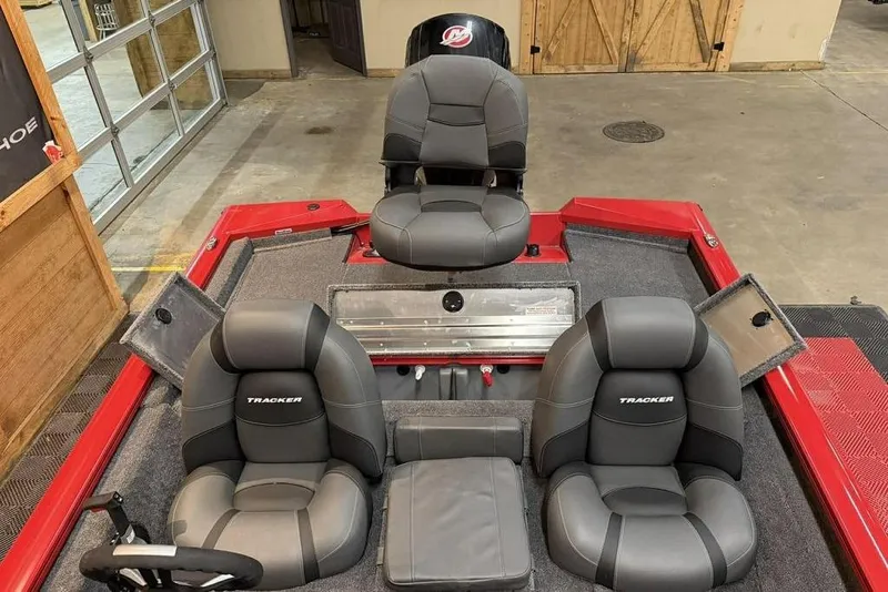 Slide: The Image of 2026 Tracker Pro Team 190 boat interior with gray seats and red accents. - 8