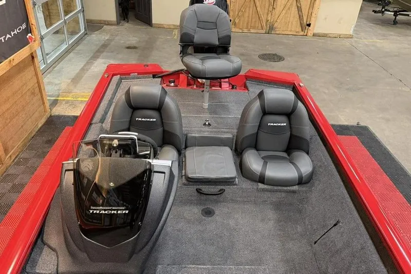 Slide: The Image of 2026 Tracker Pro Team 190 boat interior with gray seating and red accents. - 9