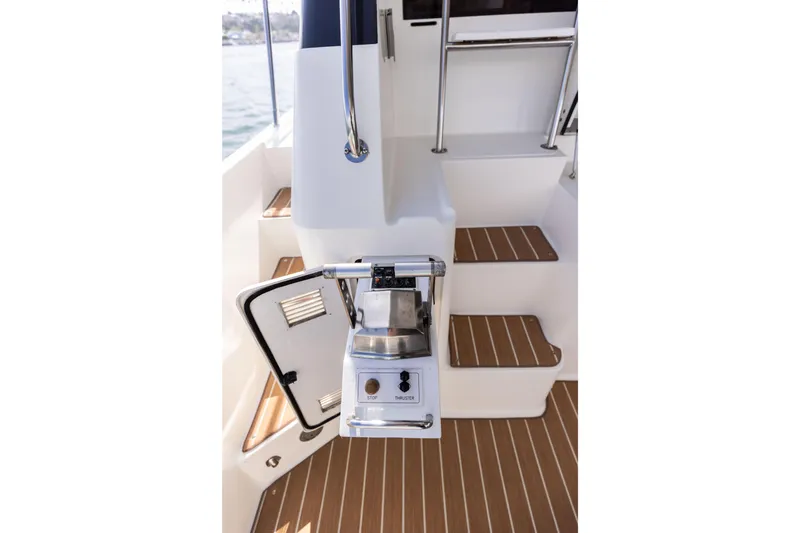 Slide: The Image of 1997 West Bay Sonship yacht stairs with teak flooring and control panel. - 11