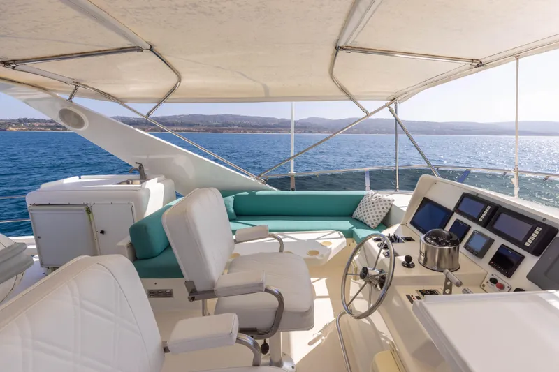 Slide: The Image of Luxurious 1997 West Bay Sonship yacht interior with helm, seating, and ocean view. - 14